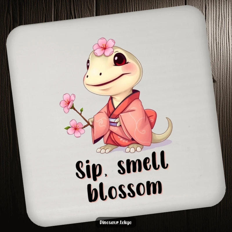 Funny Compsognathus Kimono Coaster featuring a grinning tiny dinosaur in a small kimono, offering a cherry blossom for humorous surface protection.
