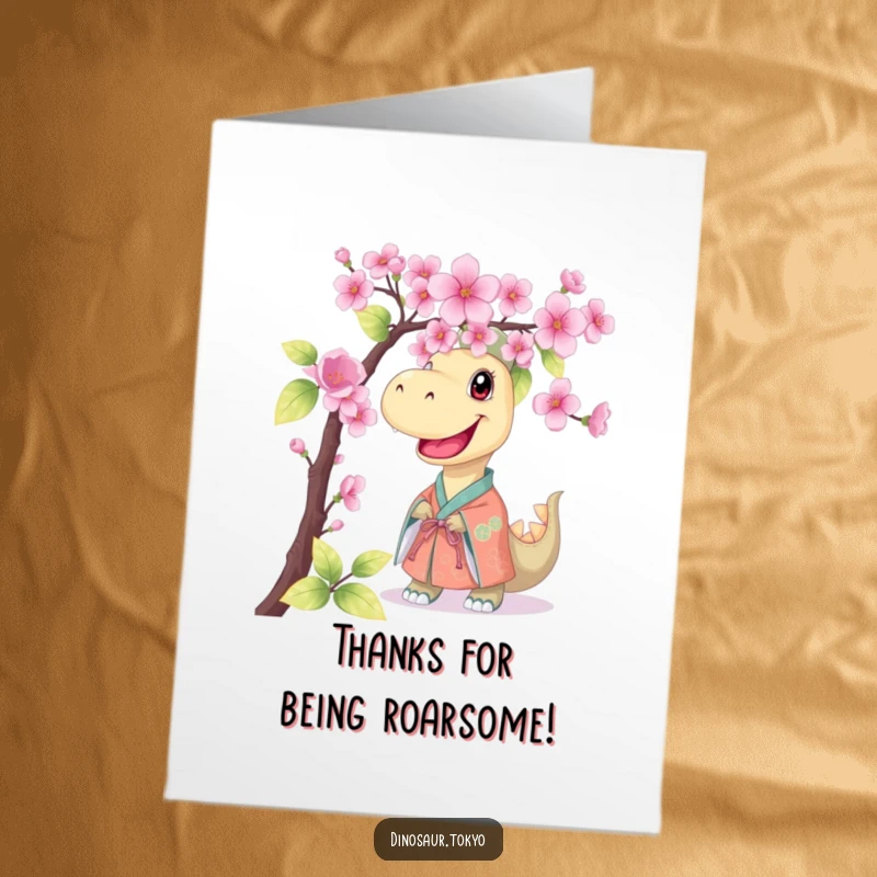Funny Free Printable Thank You Card: Smiling kimono dinosaur offering thanks behind cherry blossoms, unique DIY thank you.