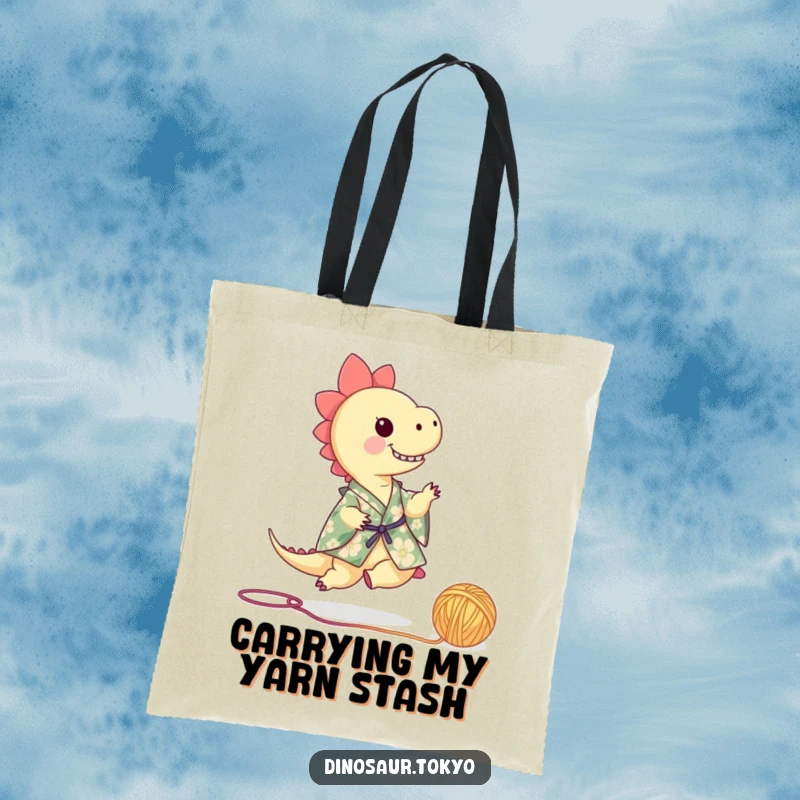 Funny dinosaur in a floral kimono playfully kicking a ball of yarn, a stylish and humorous tote bag for everyday use.